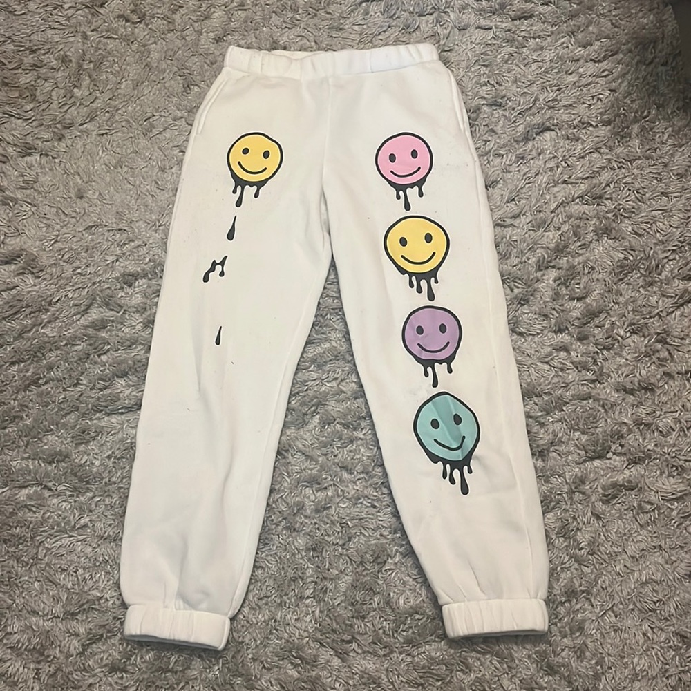 White smiley face sweatpants